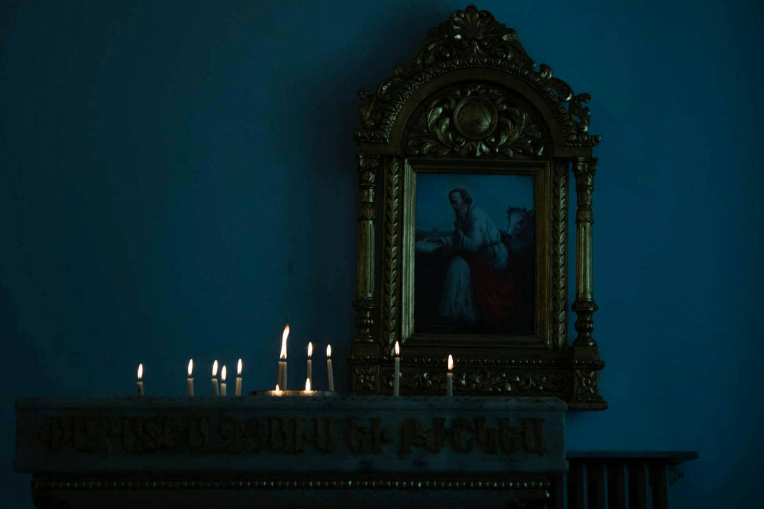 Burning candles on an altar in low light — protection ritual step by step