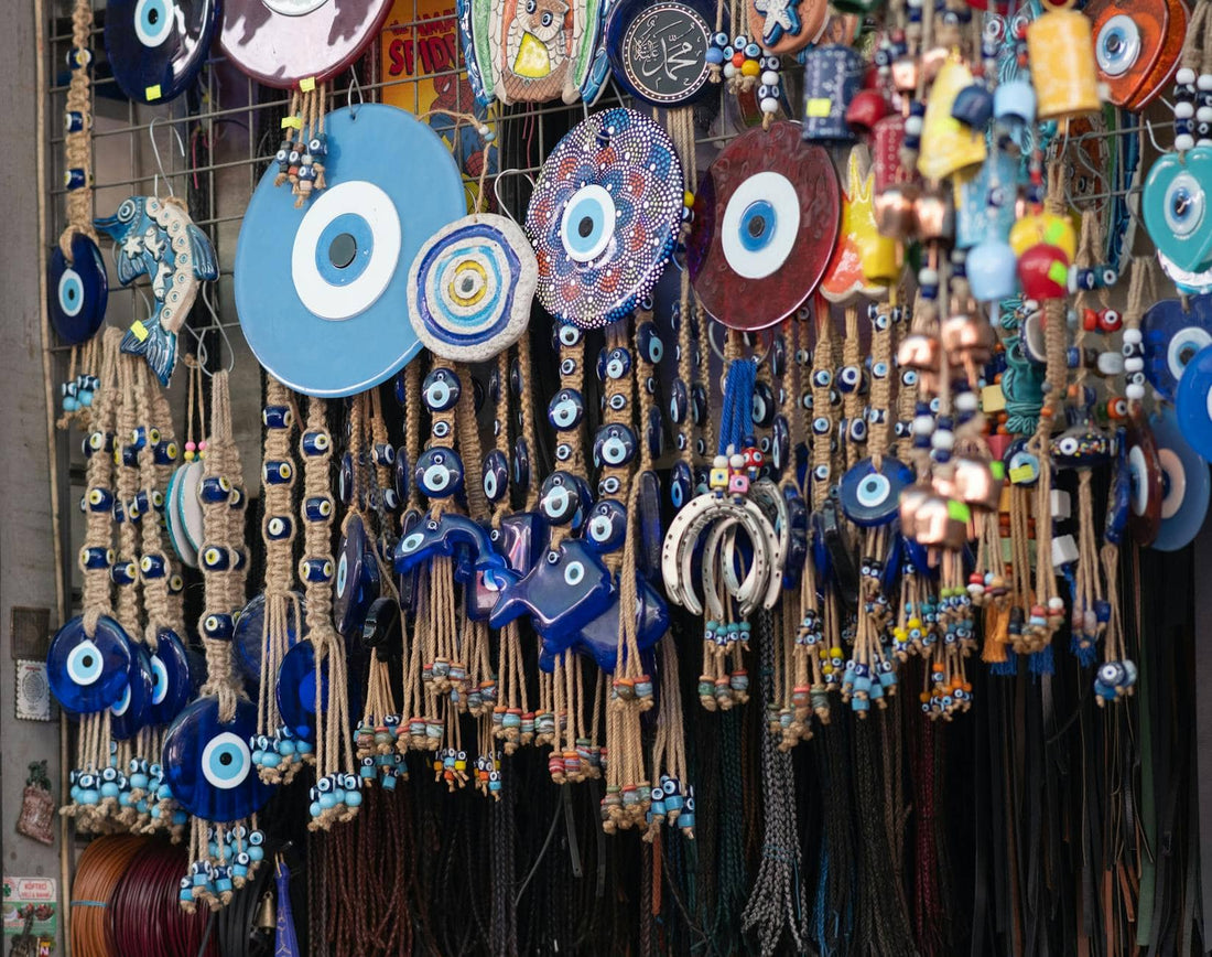 Traditional blue evil eye beads at a market — how to know if someone put the evil eye on you