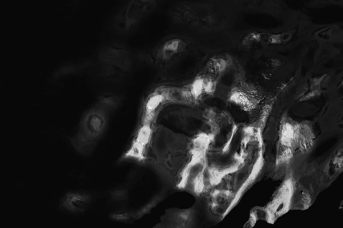 The Hermetic principle of polarity — black and white abstract shapes, one scale running between two ends